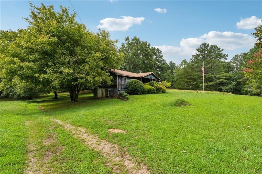 8265 Seabolt Drive Ball Ground, GA 30107 - Photo 4 of 52 a view of a house with a backyard