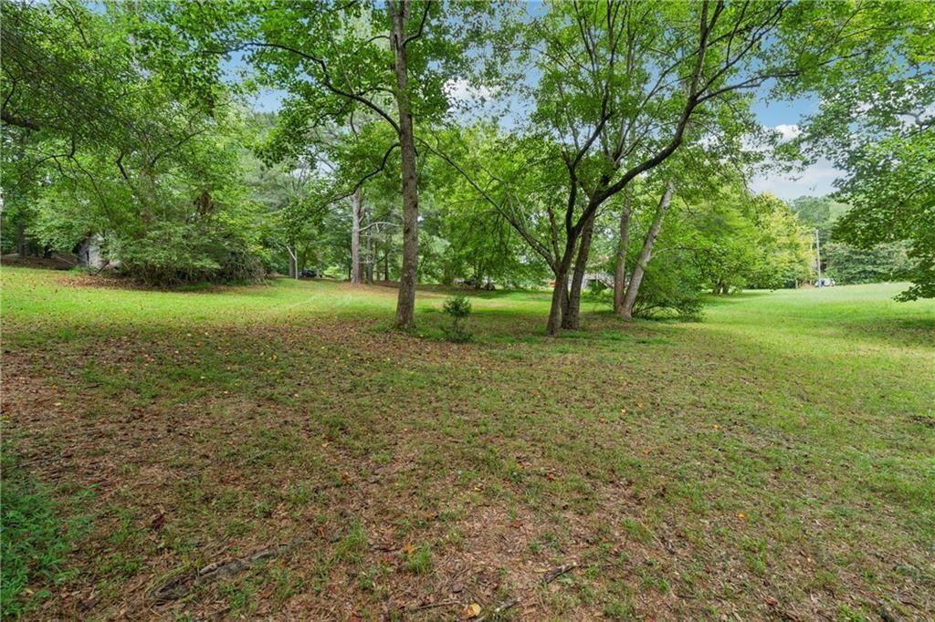 8265 Seabolt Drive Ball Ground, GA 30107 - Photo 10 of 52 a view of a field with a tree
