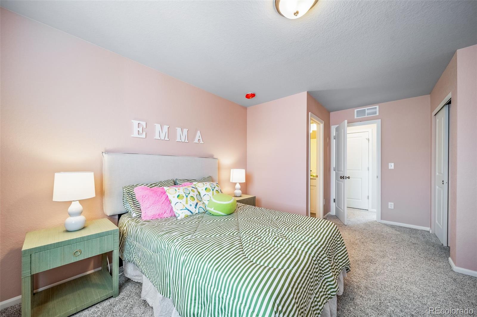 10155 Scranton Way Commerce City, CO 80022 - Photo 20 of 28 a bedroom with a bed and window