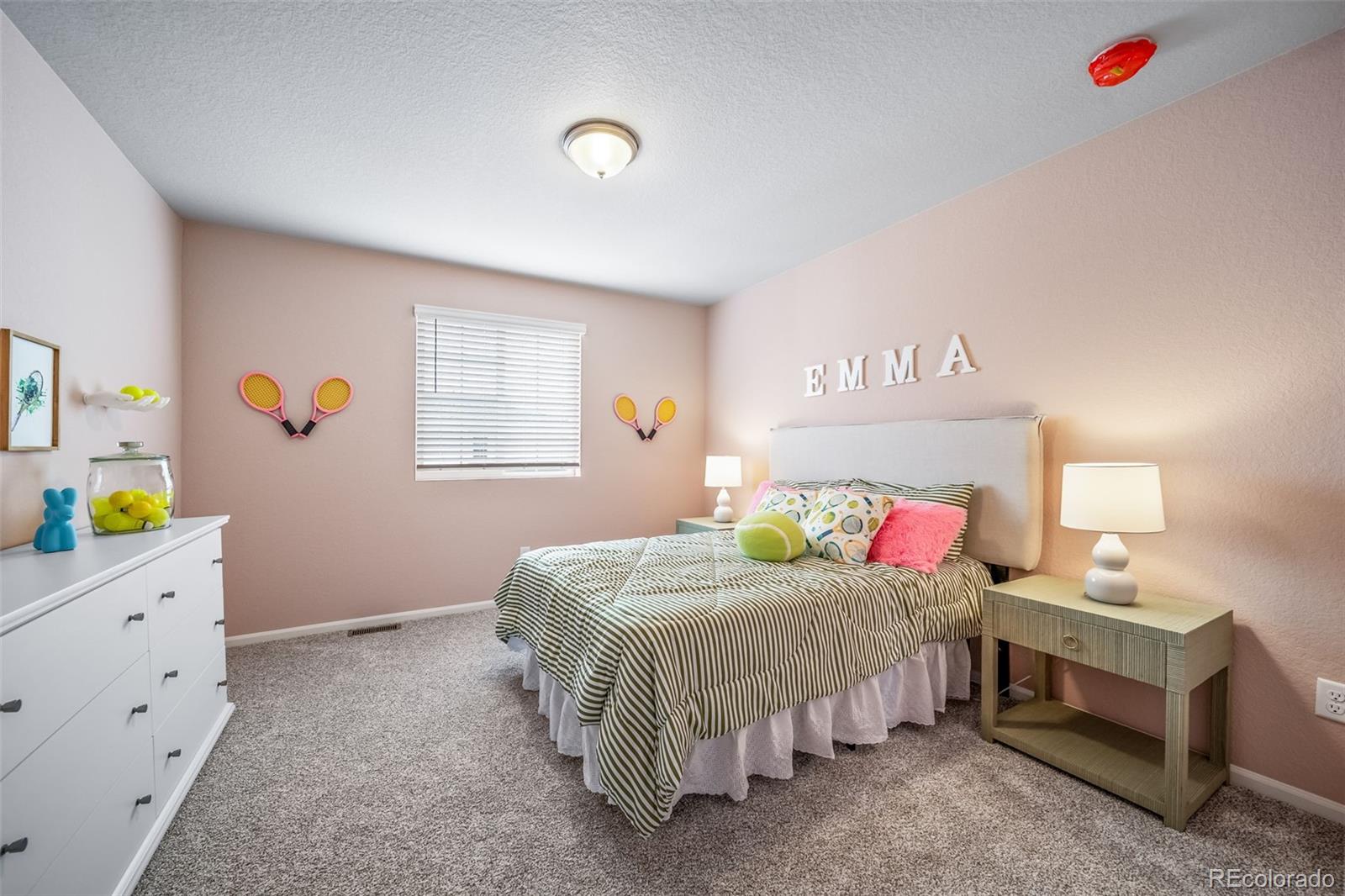 10155 Scranton Way Commerce City, CO 80022 - Photo 22 of 28 a bedroom with a bed and a window