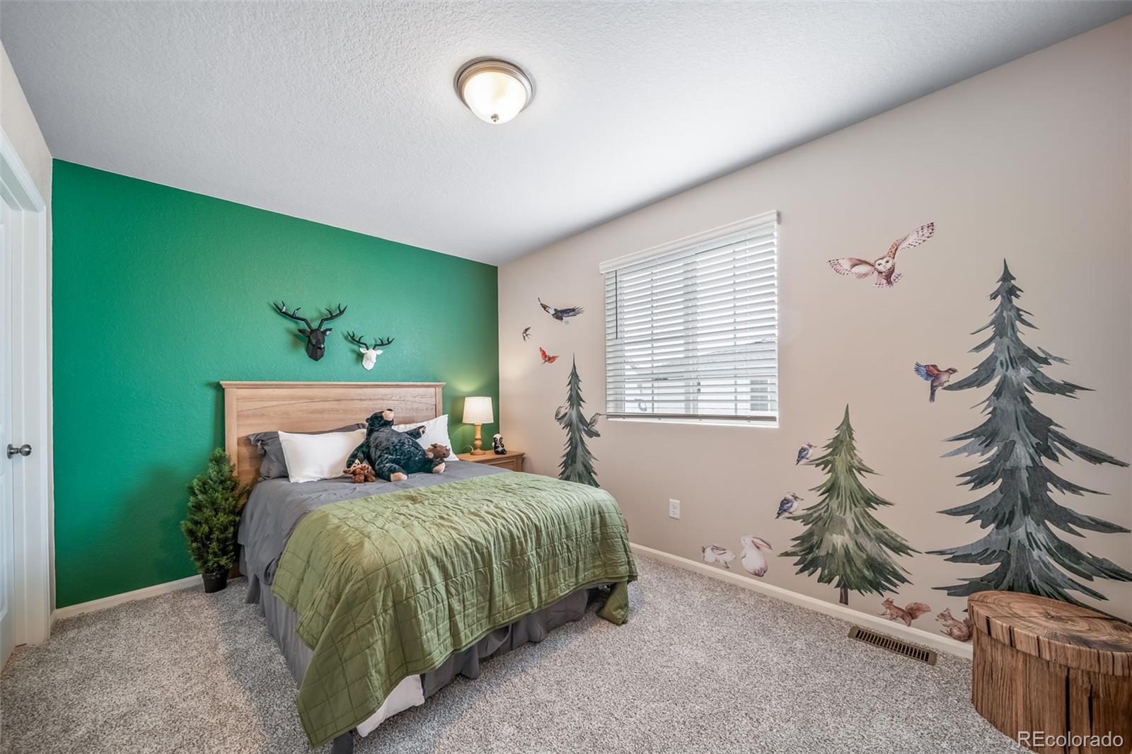 10155 Scranton Way Commerce City, CO 80022 - Photo 24 of 28 a bed room with a bed and a window