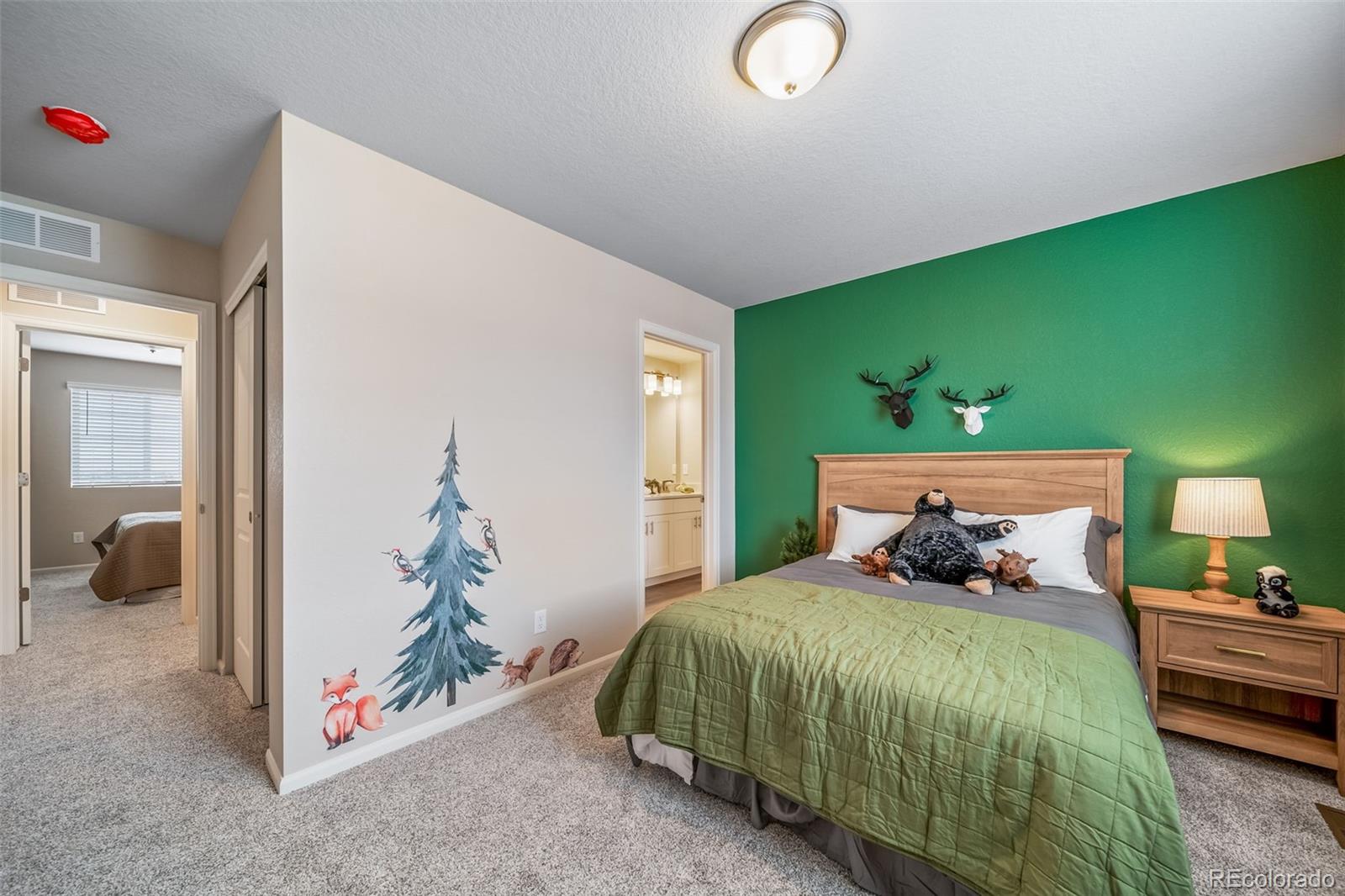 10155 Scranton Way Commerce City, CO 80022 - Photo 26 of 28 a bedroom with a bed and a window