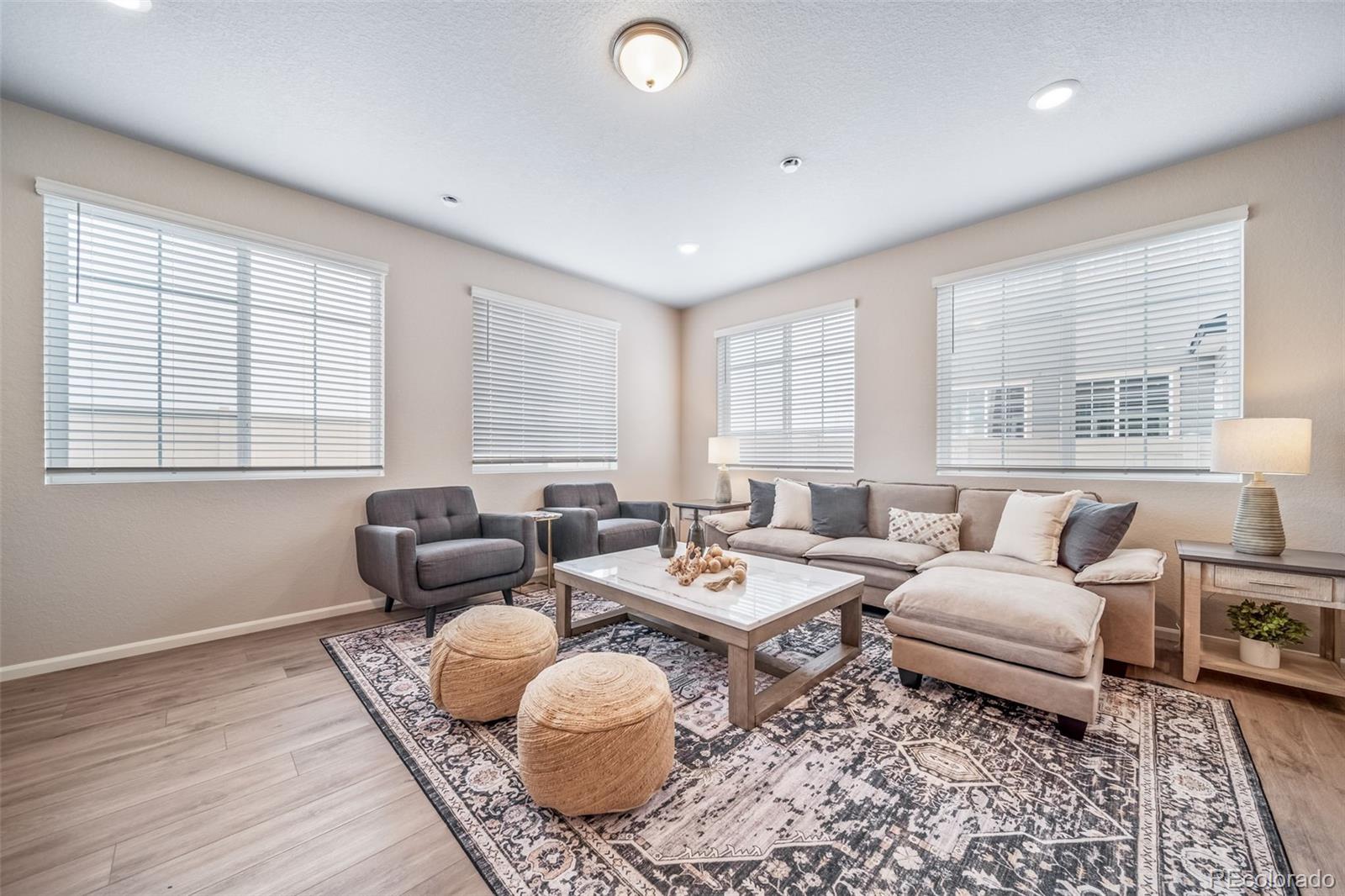 10155 Scranton Way Commerce City, CO 80022 - Photo 9 of 28 a living room with furniture and a window