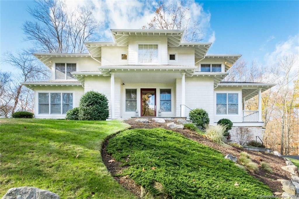 39 Partridge Road Stamford, CT 06903 - Photo 1 of 1 a view of a white house with a big yard and potted plants