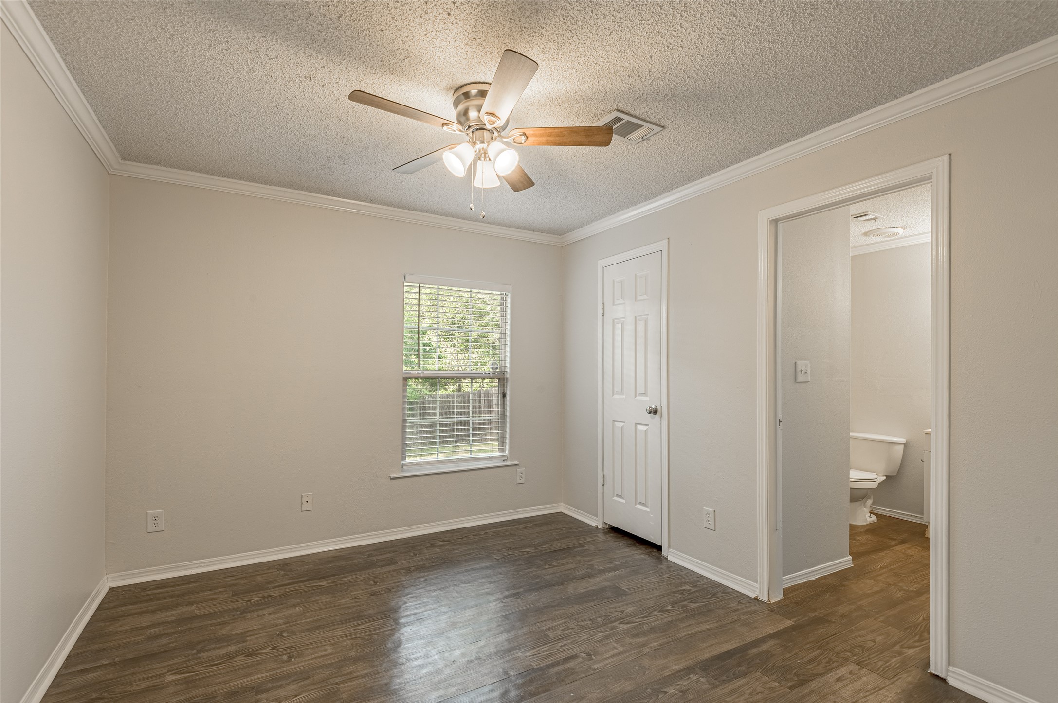 138 Varsity Circle Huntsville, TX 77340 - Photo 18 of 37 a view of an empty room with a window