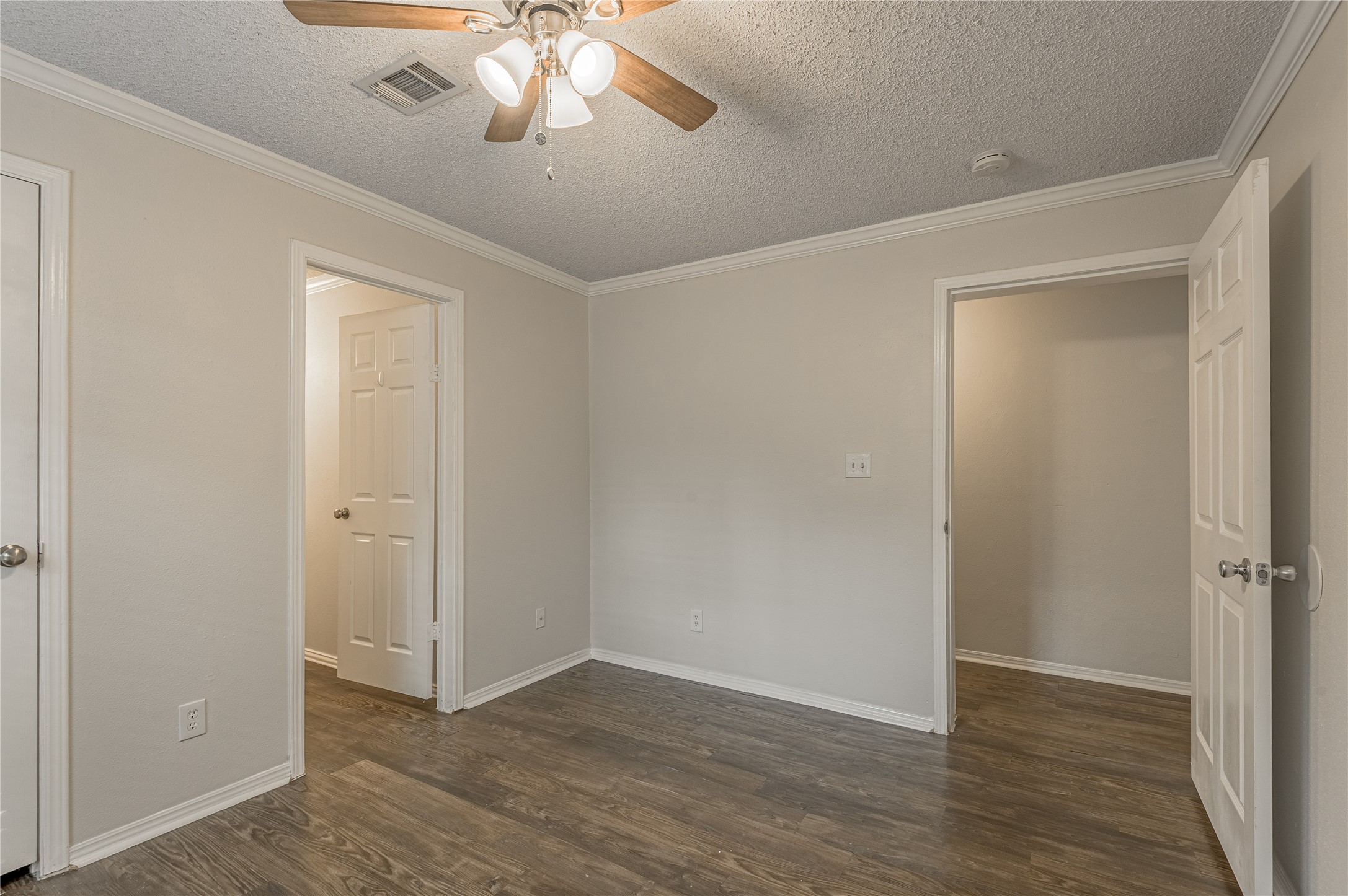 138 Varsity Circle Huntsville, TX 77340 - Photo 20 of 37 a view of an empty room with wooden floor