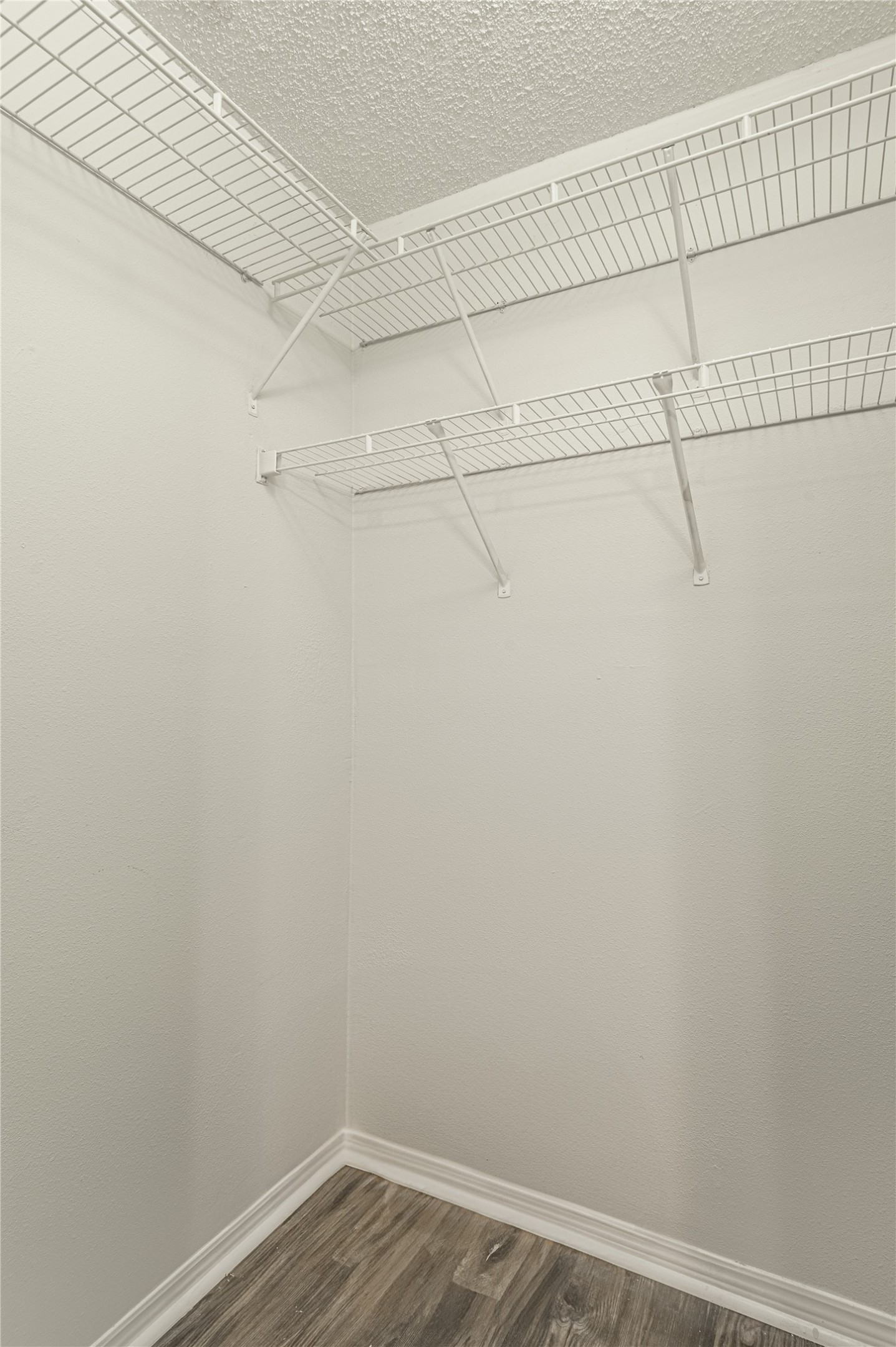 138 Varsity Circle Huntsville, TX 77340 - Photo 25 of 37 a view of a room with racks on the wall