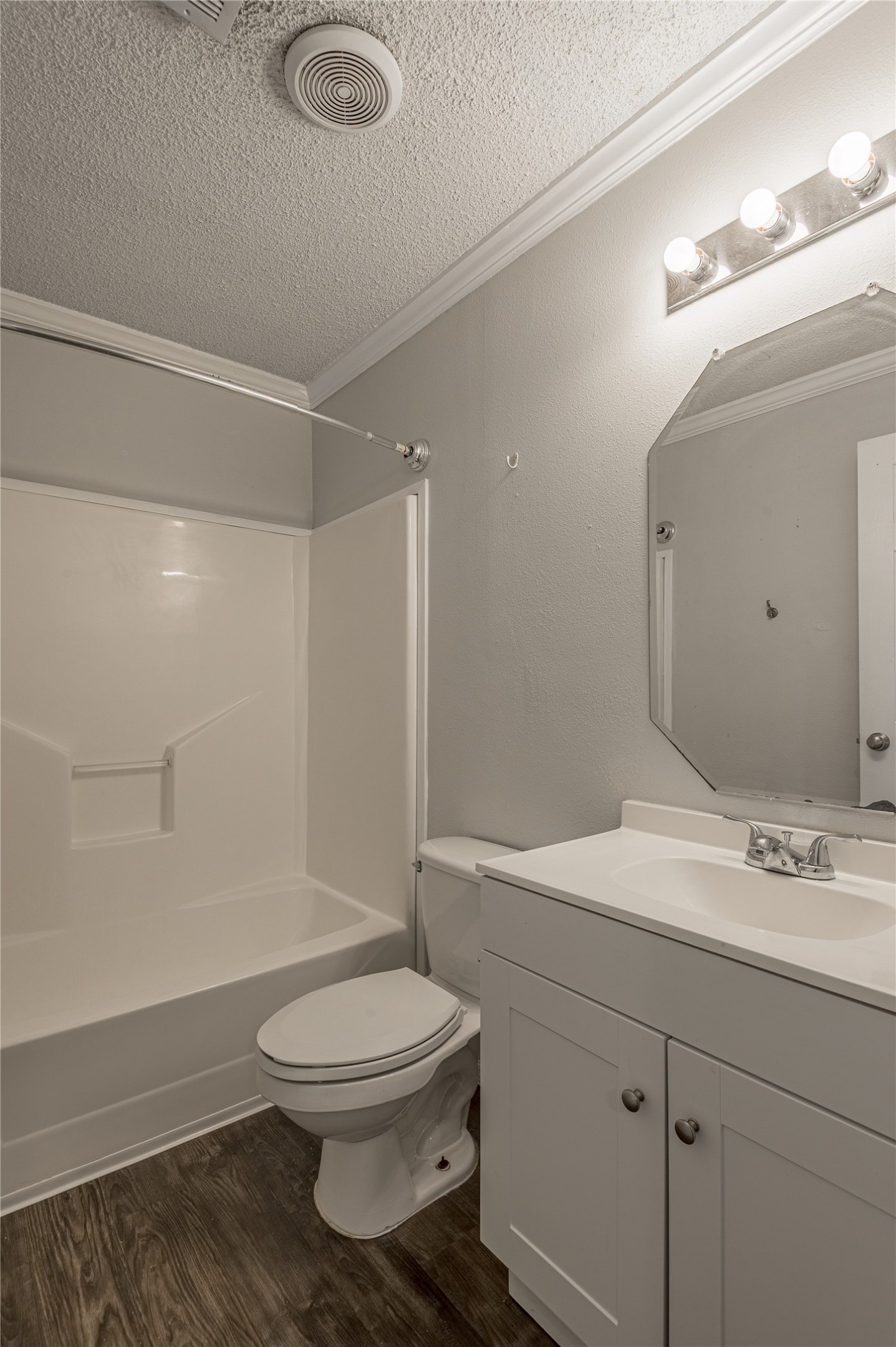 138 Varsity Circle Huntsville, TX 77340 - Photo 26 of 37 a bathroom with a toilet a sink a mirror and shower