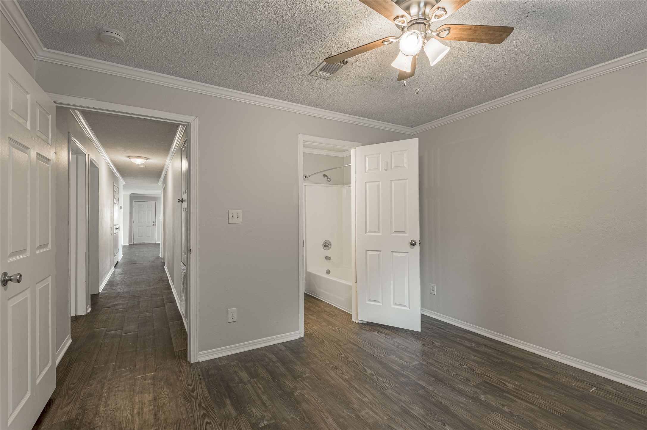 138 Varsity Circle Huntsville, TX 77340 - Photo 28 of 37 a view of a hallway with wooden floor