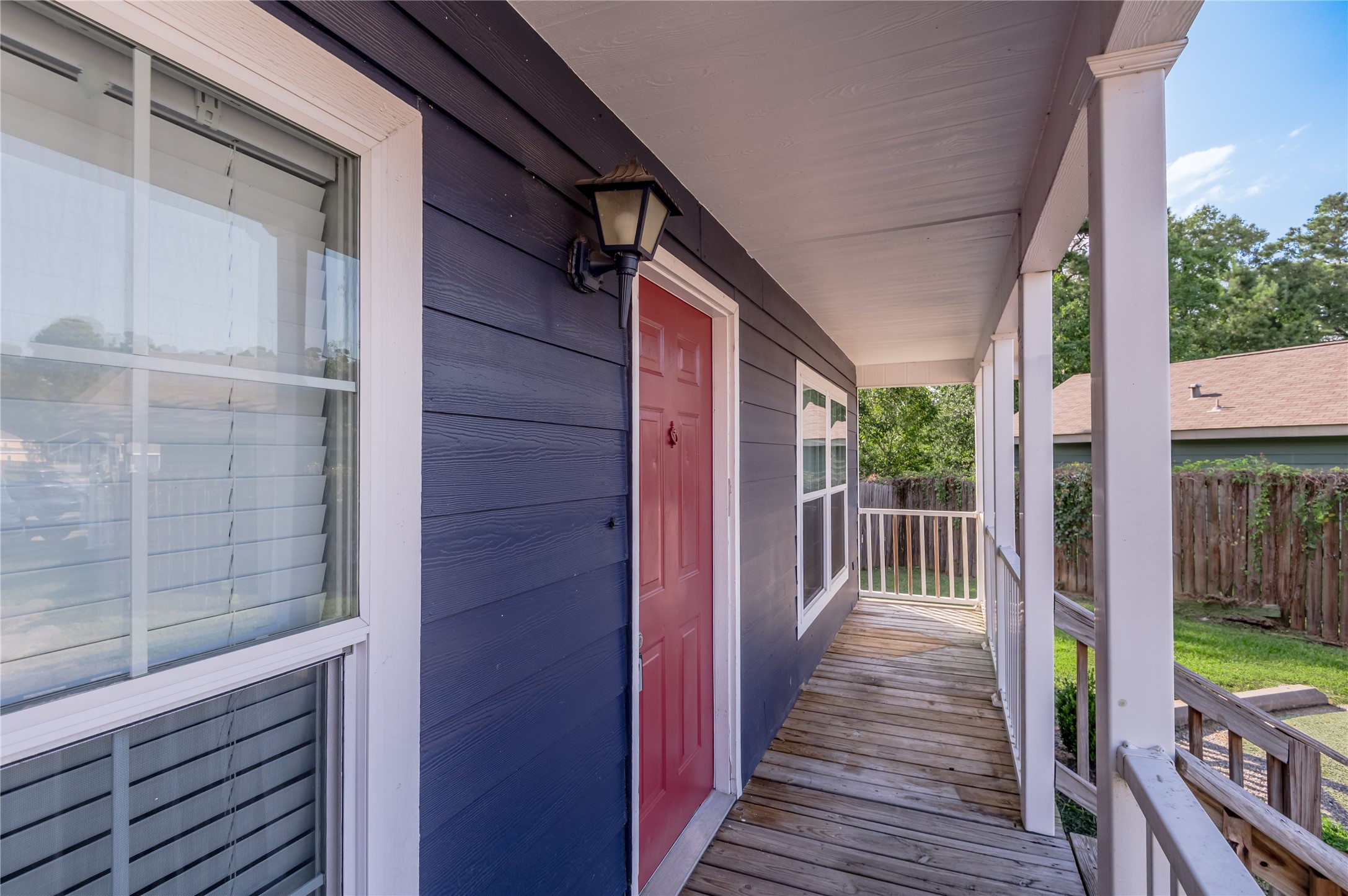 138 Varsity Circle Huntsville, TX 77340 - Photo 3 of 37 a porch with wooden floor