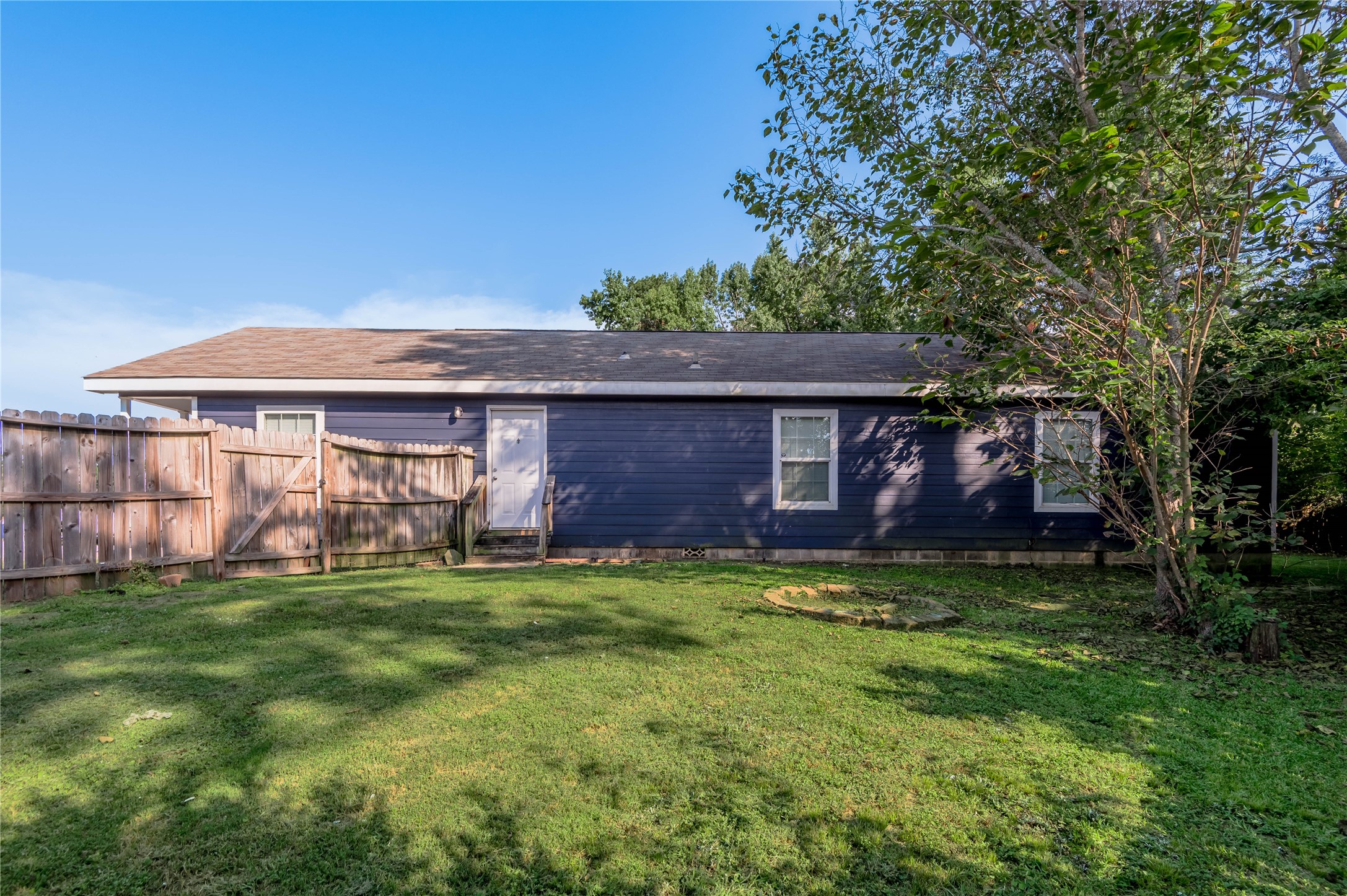 138 Varsity Circle Huntsville, TX 77340 - Photo 34 of 37 a view of a house with a yard