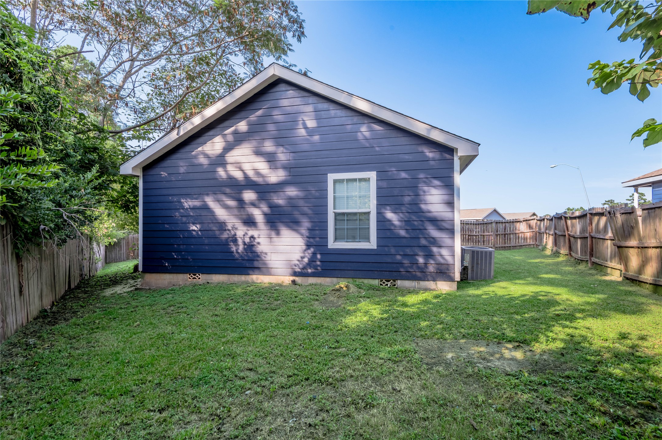138 Varsity Circle Huntsville, TX 77340 - Photo 36 of 37 a view of a house with a yard