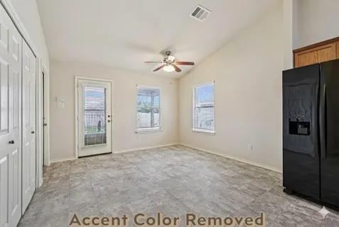 a view of an empty room with a window