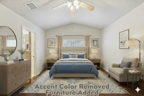 a spacious bedroom with a bed a couch and large windows