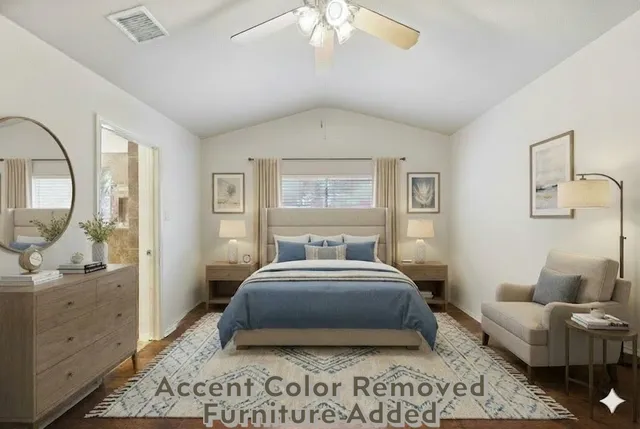 a spacious bedroom with a bed a couch and large windows