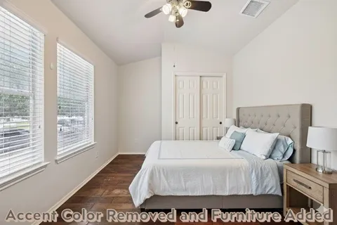 a bedroom with a bed and a window