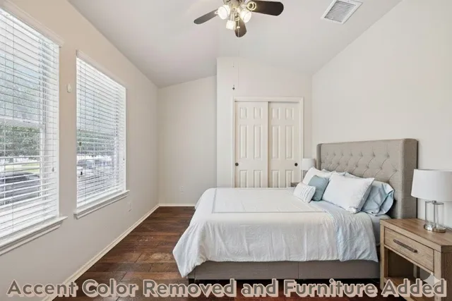 a bedroom with a bed and a window