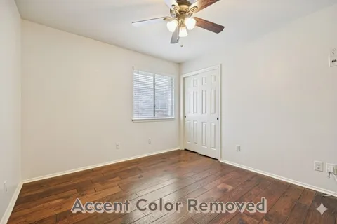 an empty room with wooden floor