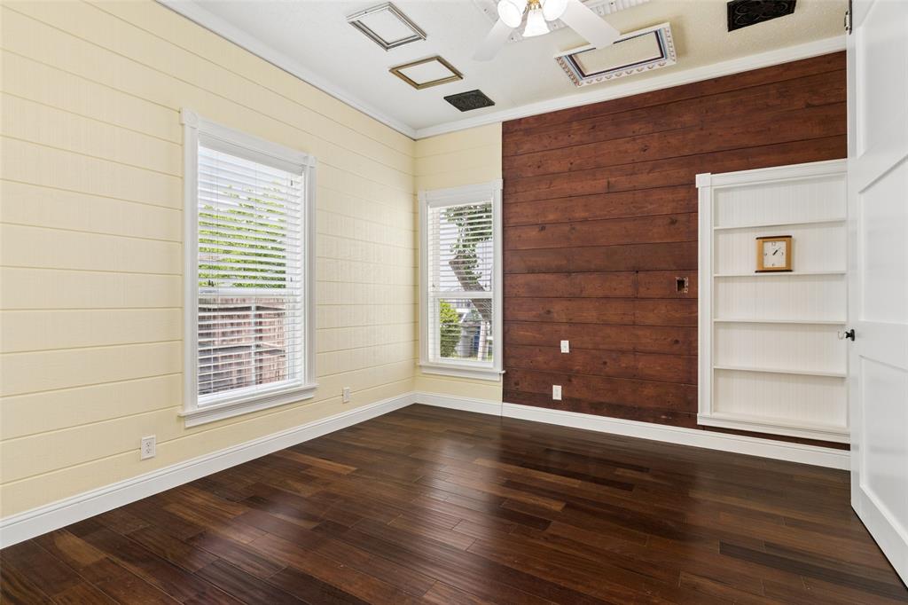 5824 Boone Street Sachse, TX 75048 - Photo 15 of 40 a view of an empty room with wooden floor and a window