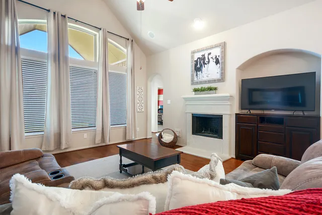 a kitchen with a sink a counter space appliances and cabinets