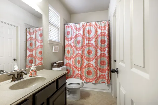 a bedroom with bed and a window