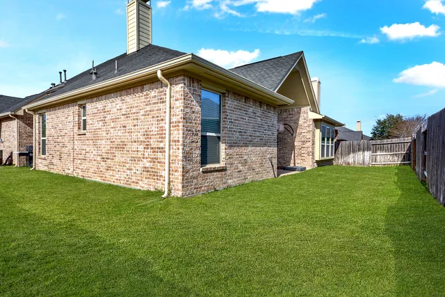 a view of an house with backyard porch and sitting area