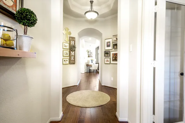 a view of a livingroom with furniture and entryway