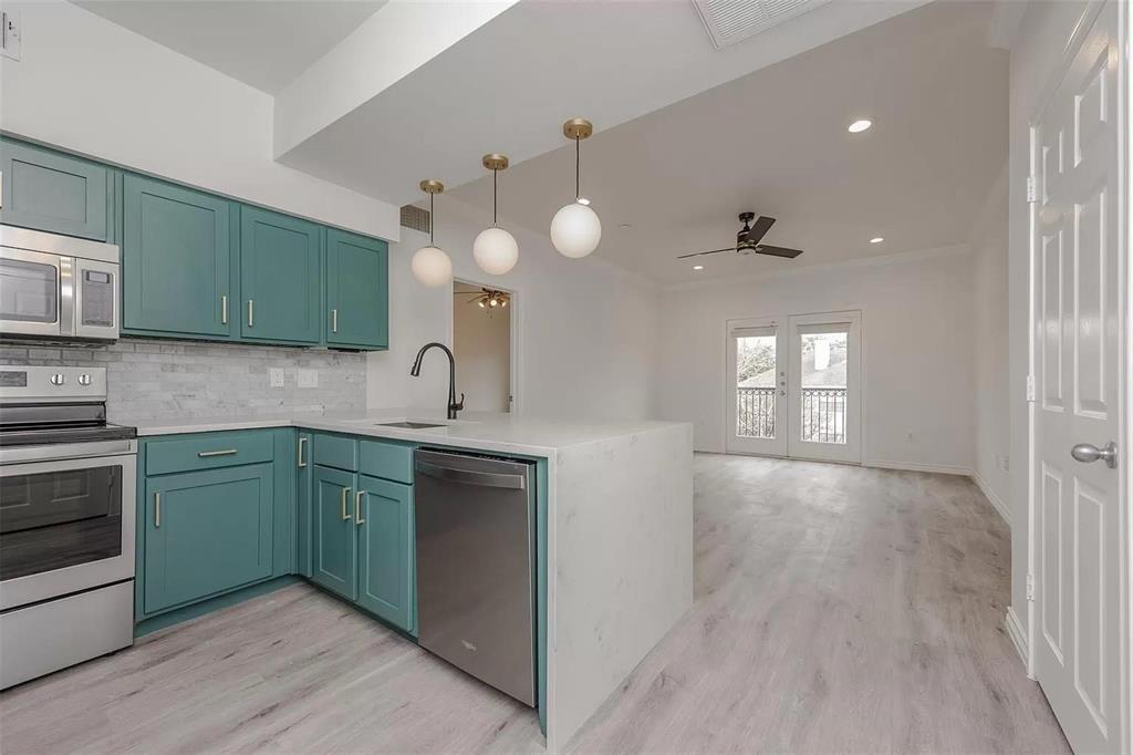 3102 Kings Road, Unit 2303 Dallas, TX 75219 - Photo 5 of 23 a kitchen with sink and cabinets