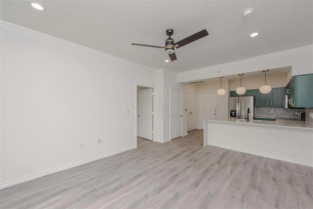 3102 Kings Road, Unit 2303 Dallas, TX 75219 - Photo 7 of 23 a view of a kitchen with wooden floor