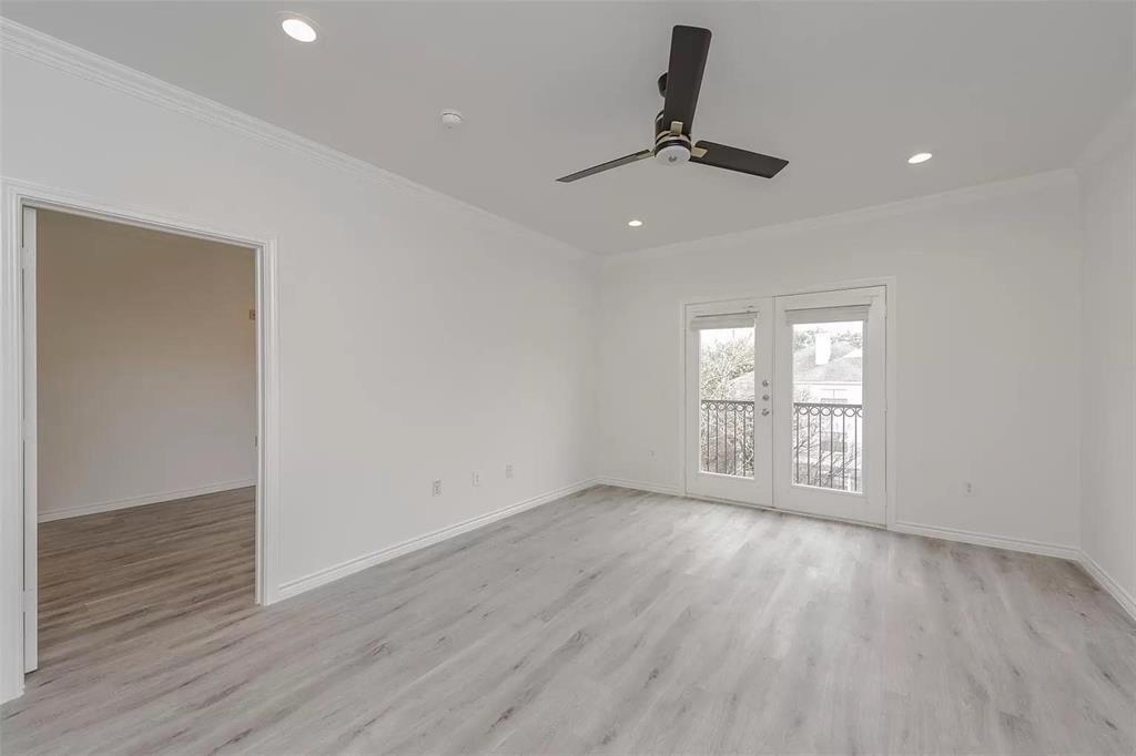 3102 Kings Road, Unit 2303 Dallas, TX 75219 - Photo 8 of 23 wooden floor in an empty room with a window