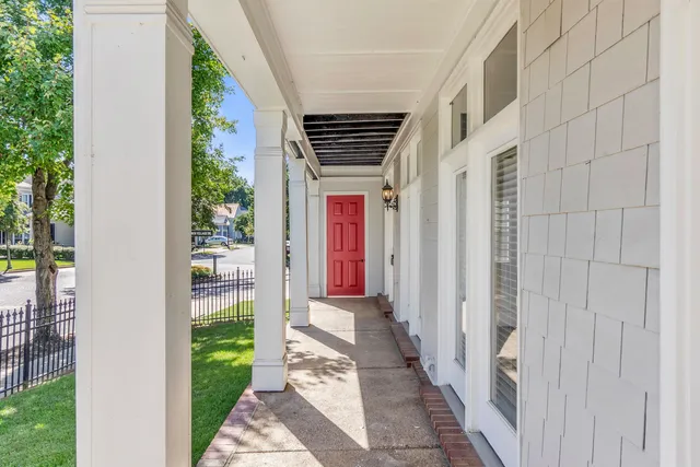 a view of a hallway with wooden walls and entryway