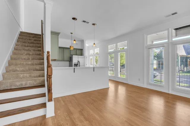 a view of kitchen with furniture and wooden floor