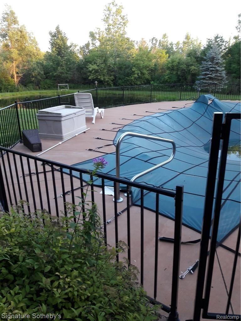 5000 Lake Pleasant Road North Branch, MI 48461 - Photo 23 of 34 Pool has the cover on and is ready to be filled and used right now. 12ft deep end makes it very usable for people of all heights. Jump on in!!