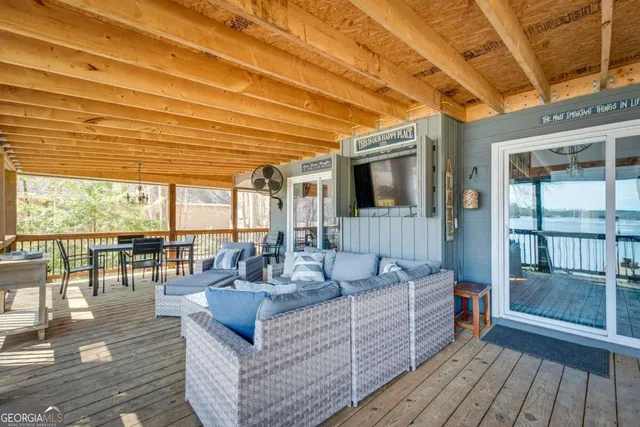 a view of a lake with a house in the background