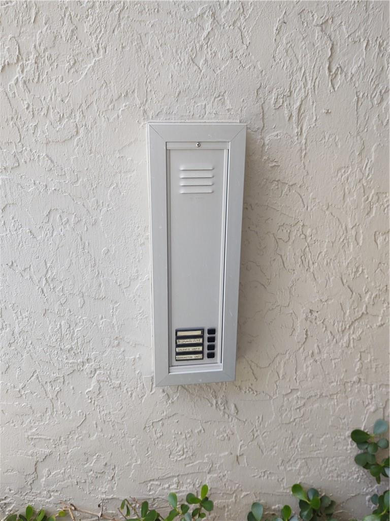 5801 Coach House Circle, Unit B Boca Raton, FL 33486 - Photo 4 of 39 Intercom system outside of lobby door
