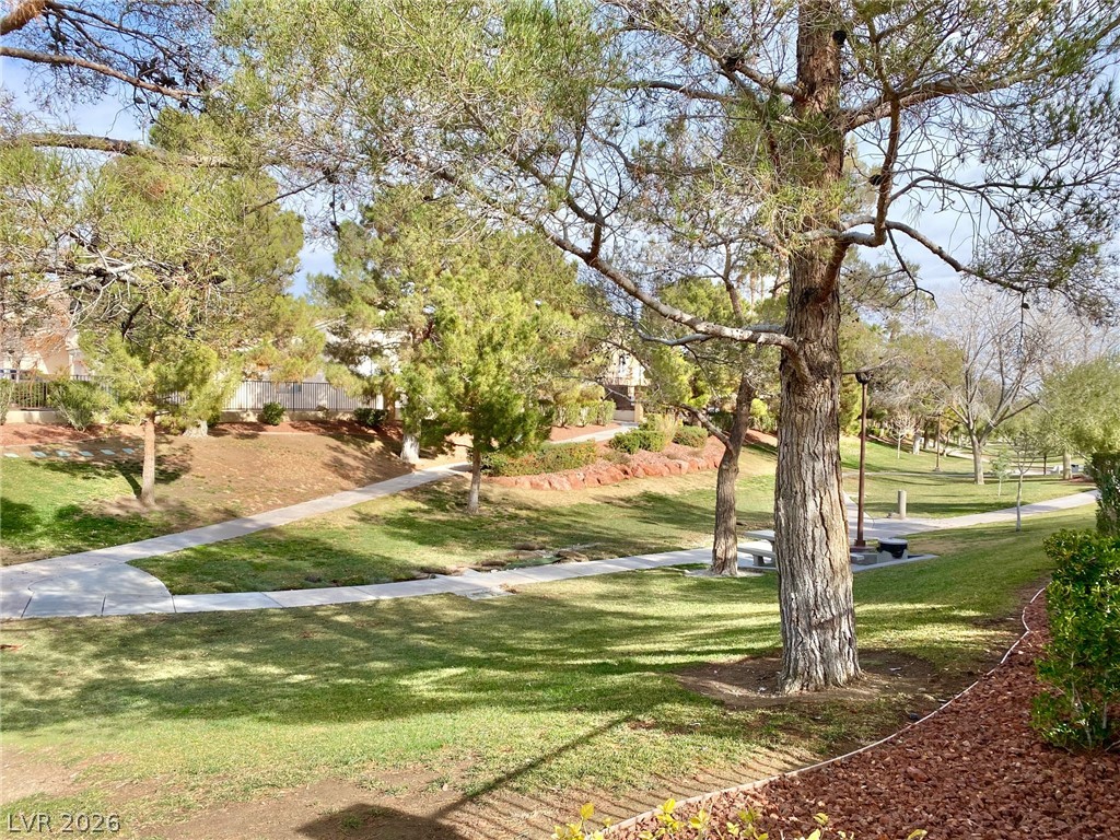 2000 Turquoise Ridge Street, Unit 204 Las Vegas, NV 89117 - Photo 10 of 29 Meandering pathways invite leisurely strolls through this tranquil, tree-lined green space.