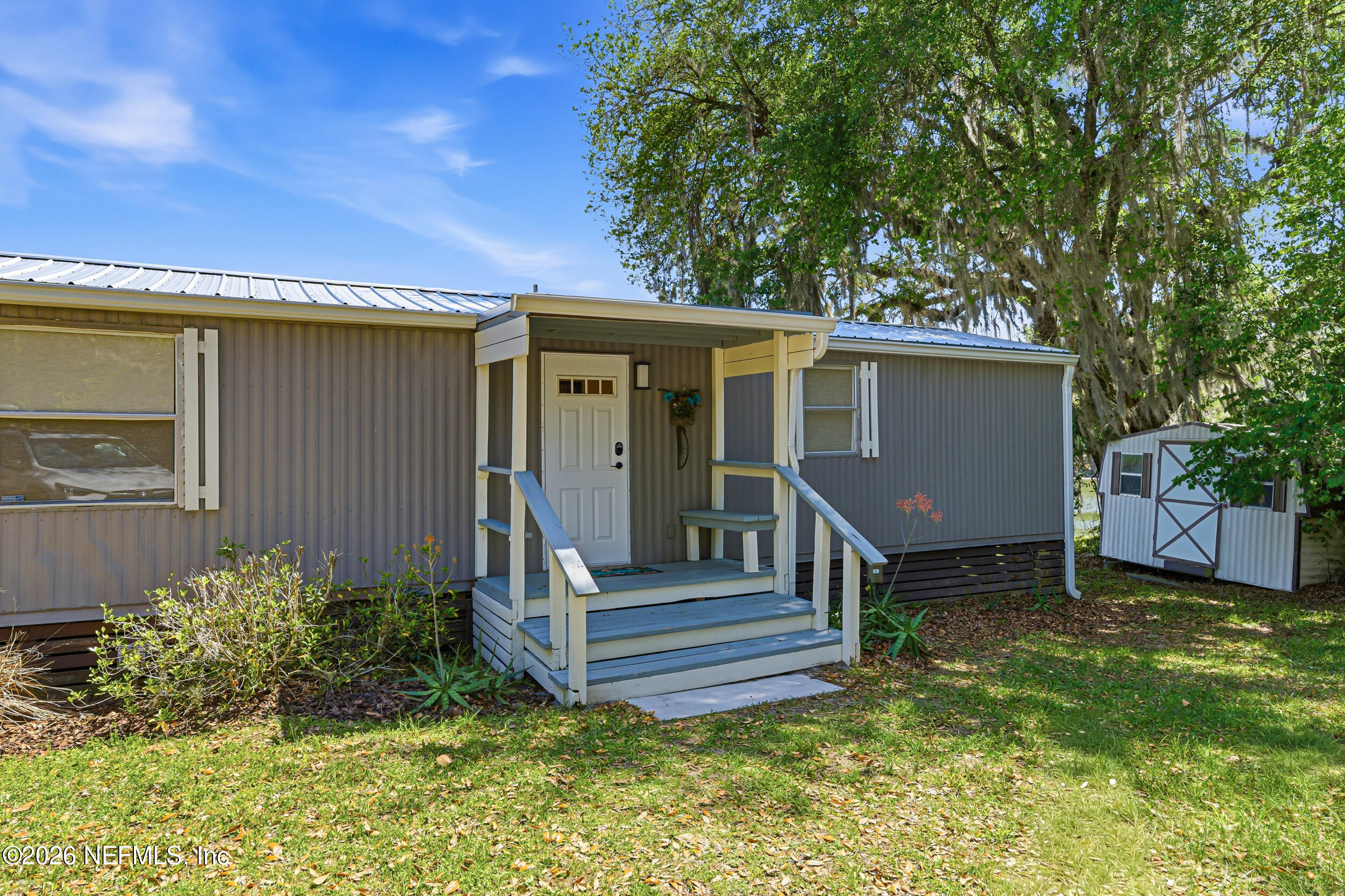 115 Lake Susan Road Hawthorne, FL 32640 - Photo 2 of 62 a view of a house with a yard