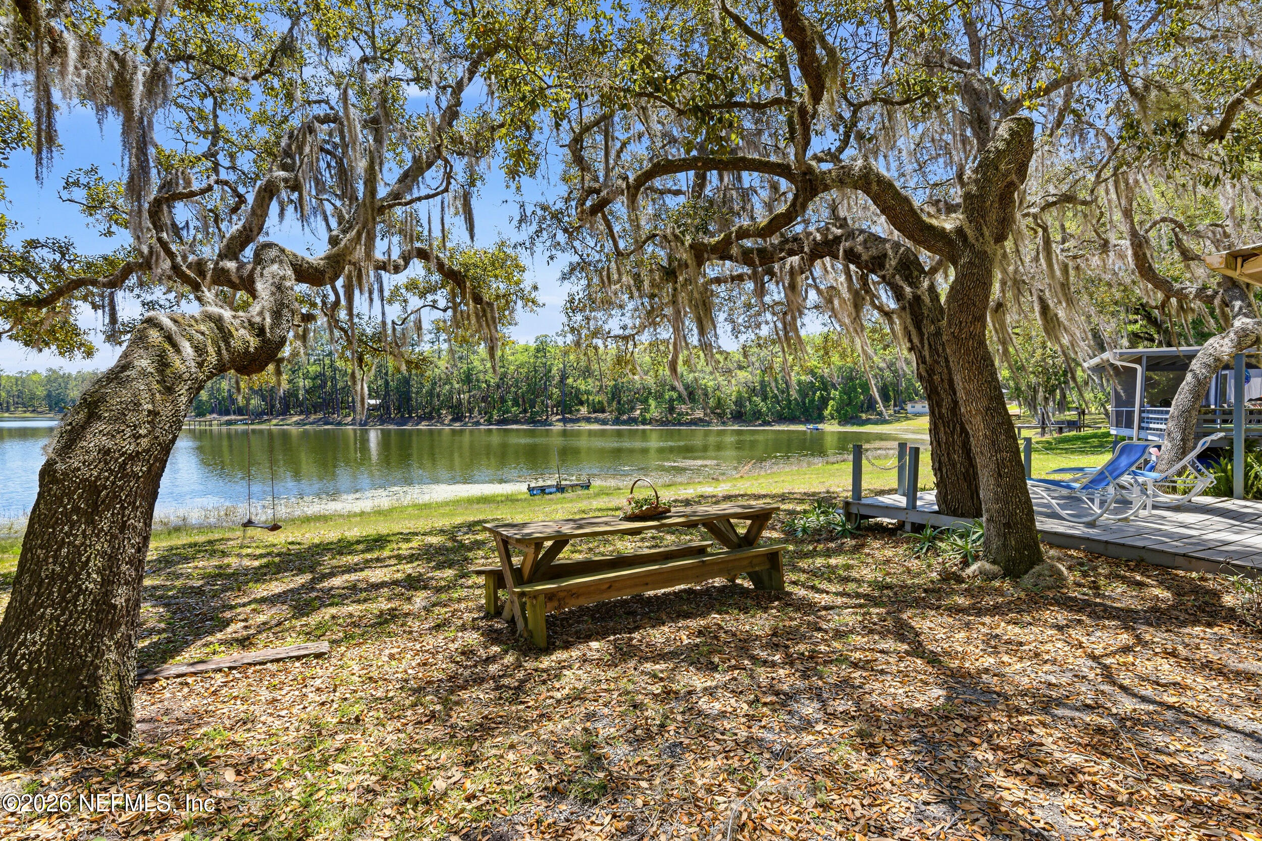 115 Lake Susan Road Hawthorne, FL 32640 - Photo 38 of 62 a view of a lake with houses in the back