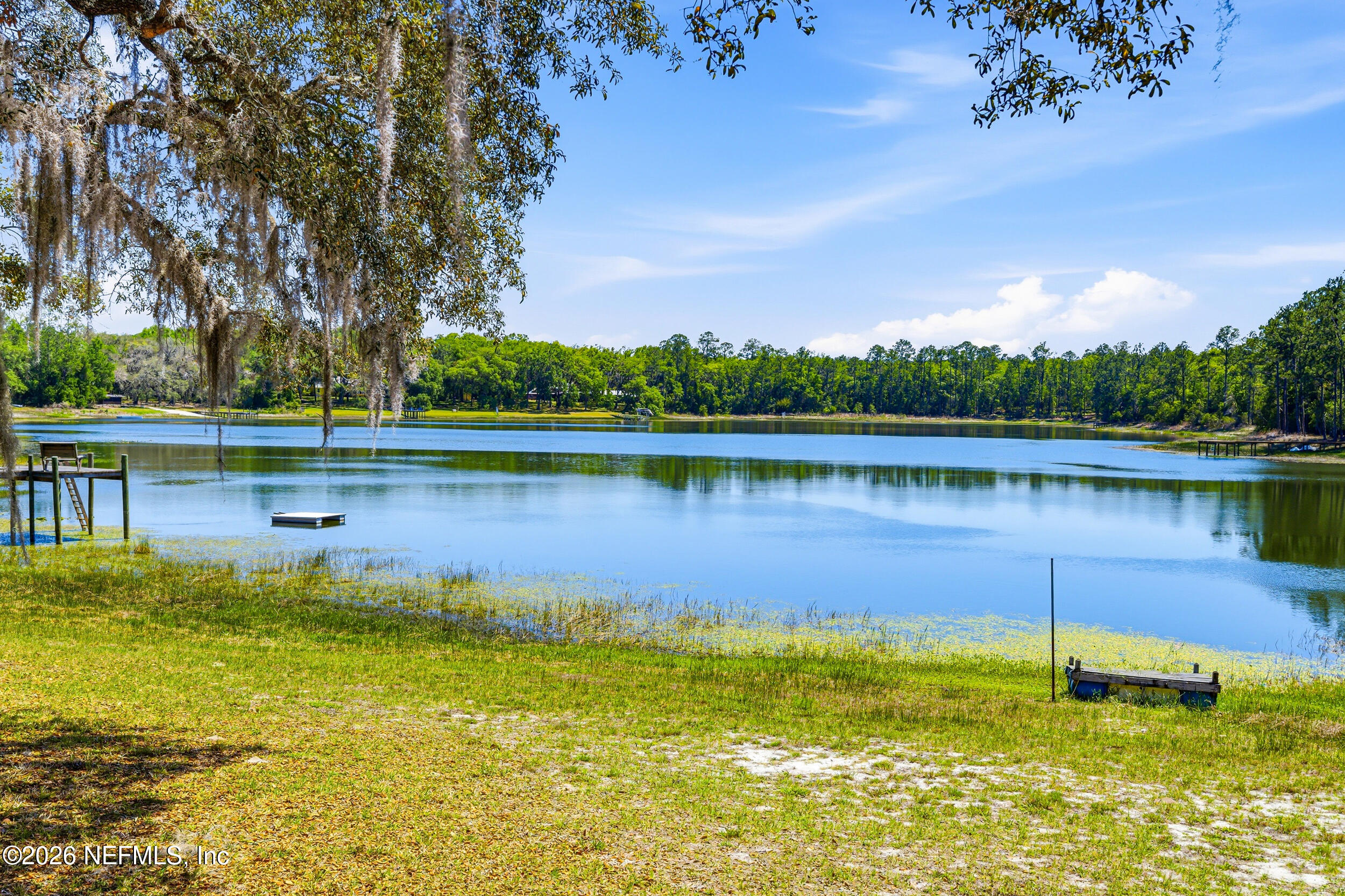 115 Lake Susan Road Hawthorne, FL 32640 - Photo 39 of 62 a view of a lake with a big yard