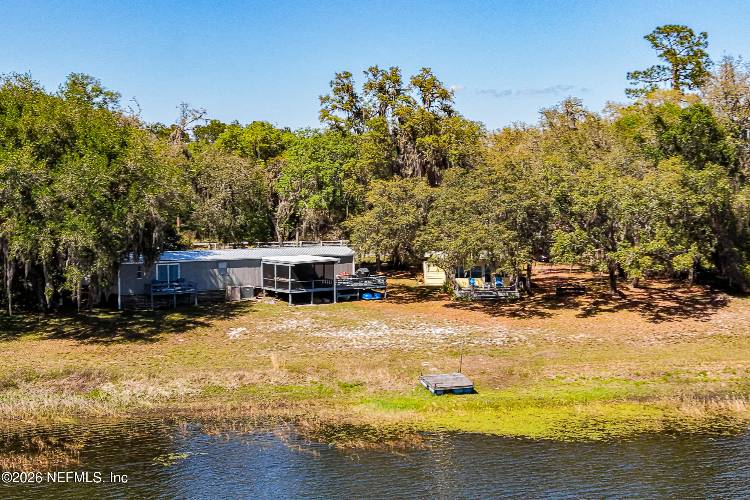 115 Lake Susan Road Hawthorne, FL 32640 - Photo 60 of 62 a view of a house with snow yard and swimming pool