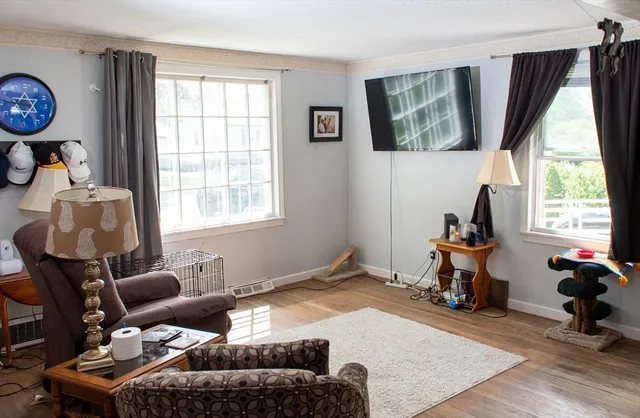 a bedroom with furniture and a window