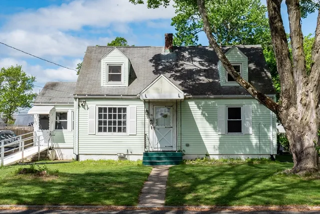 front view of a house with a yard