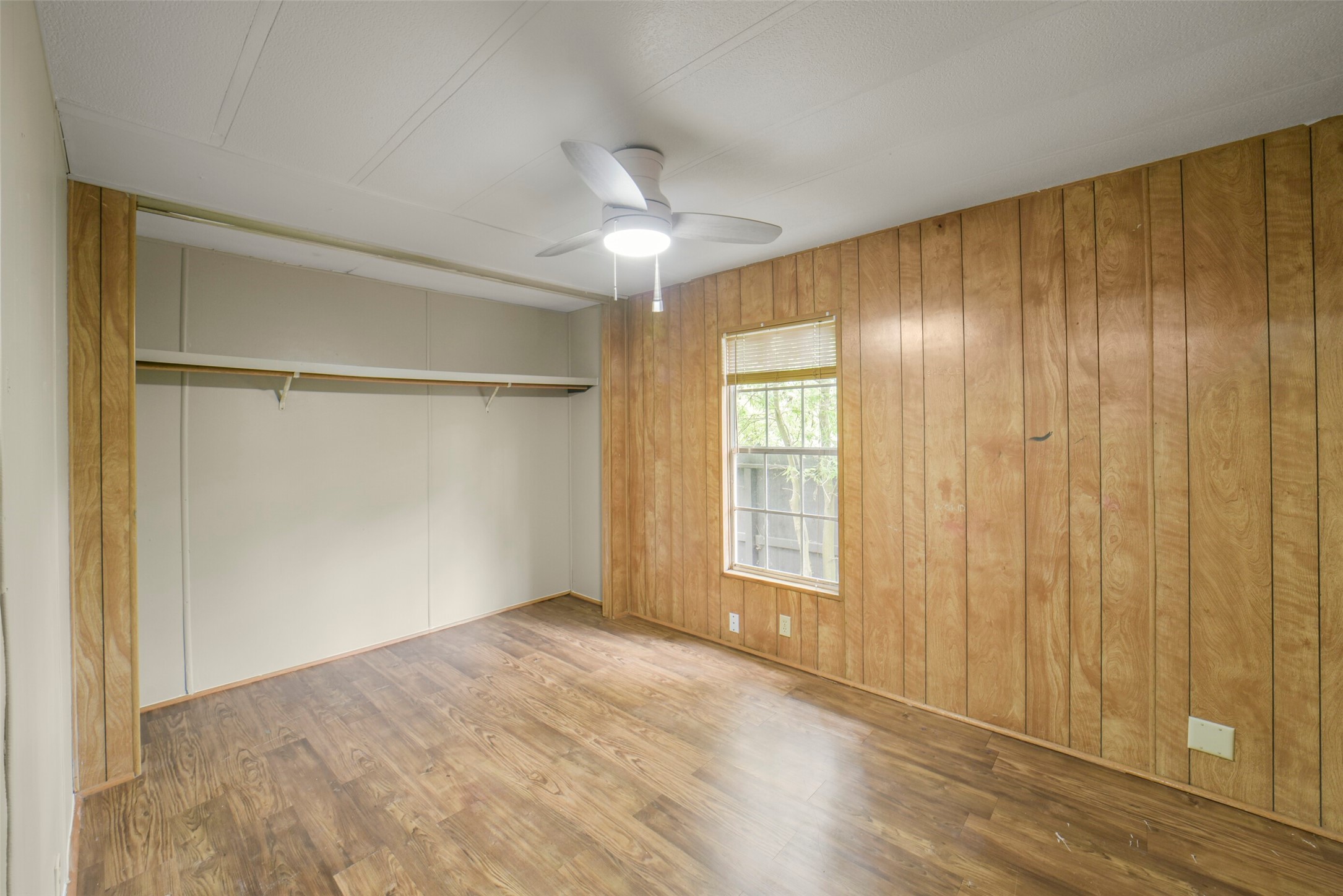 11023 Forrest Valley Drive Houston, TX 77065 - Photo 28 of 47 a view of an empty room with a window and wooden floor