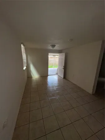 a view of an empty room and window