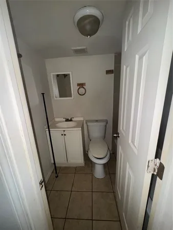 a bathroom with a toilet and a sink