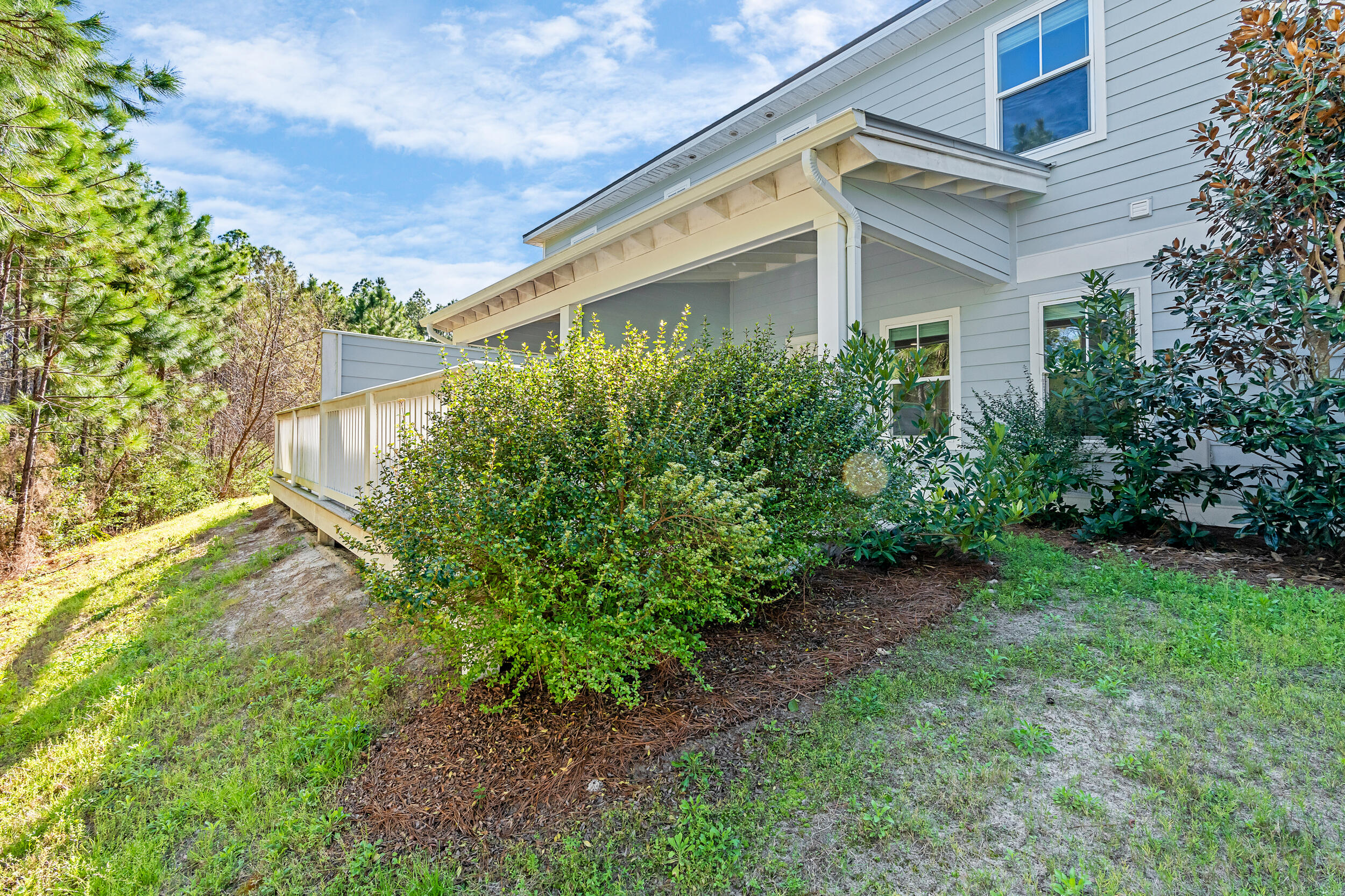 75 Golden Bell Ct Inlet Beach, Unit 75C Inlet Beach, FL 32461 - Photo 4 of 48 a view of a house with a yard and plants