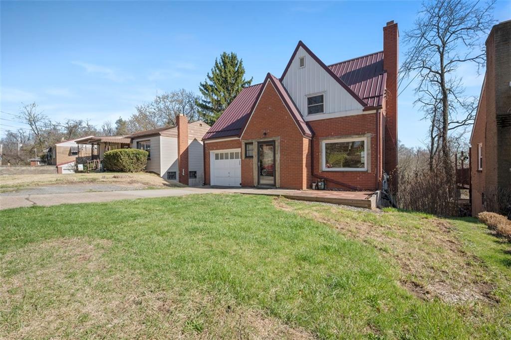 259 Bascom Avenue Pittsburgh, PA 15214 - Photo 2 of 35 a front view of a house with a garden and yard