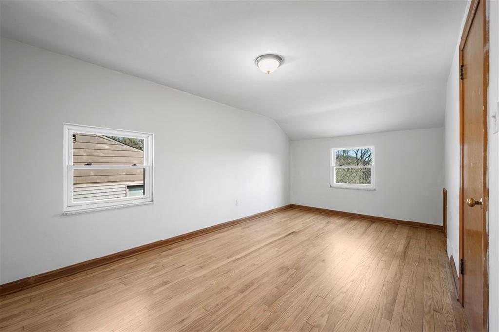 259 Bascom Avenue Pittsburgh, PA 15214 - Photo 22 of 35 an empty room with wooden floor and windows