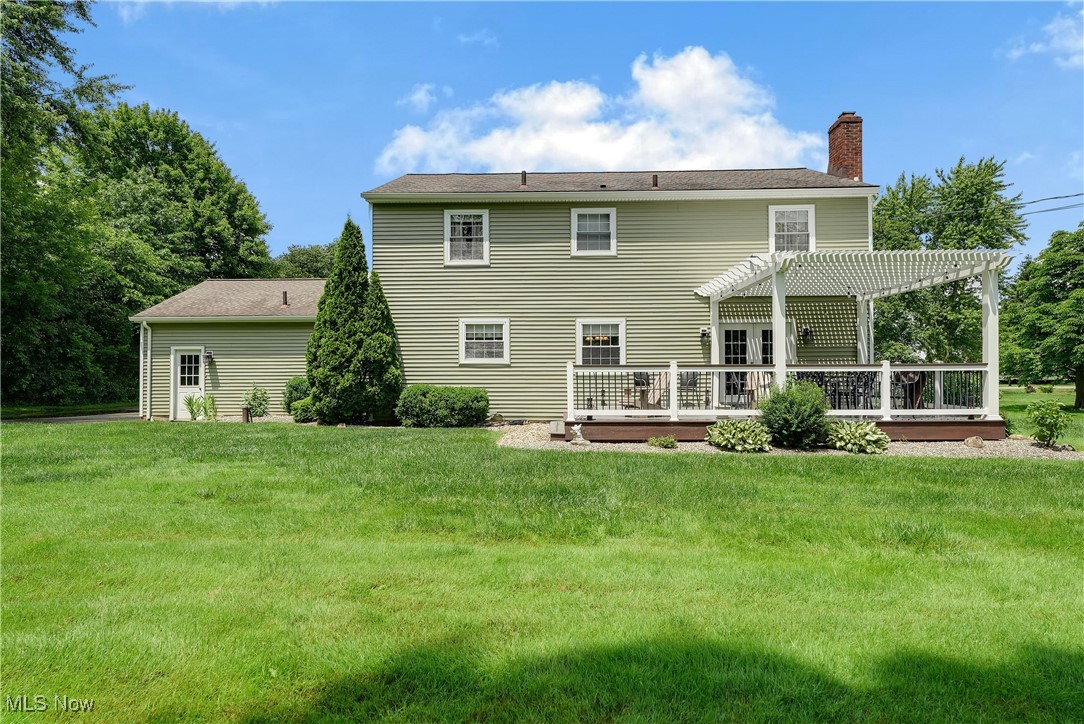 1862 Middleton Road Hudson, OH 44236 - Photo 25 of 32 Back of house featuring a pergola, a chimney, a deck, and a yard