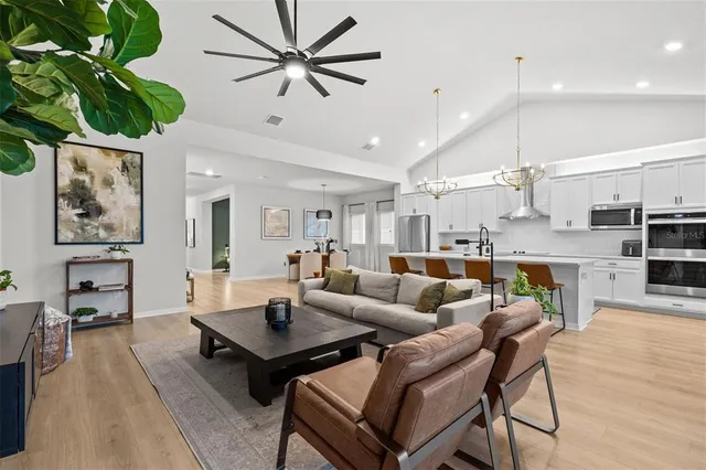 a spacious bathroom with a double vanity sink a mirror and shower